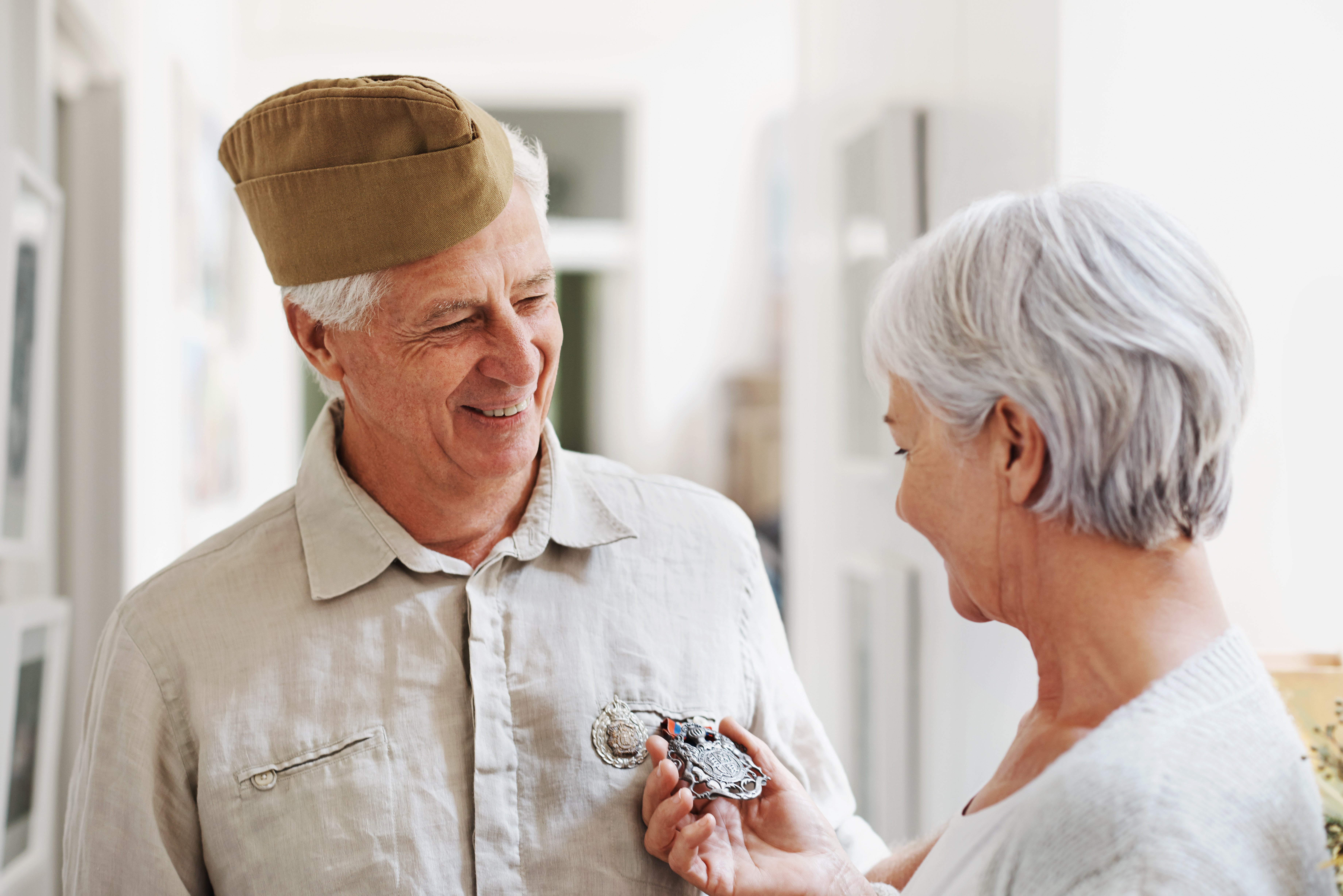 Caregiver and senior woman walking outdoors