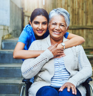 caregiver and elderly woman patient in a wheelchair